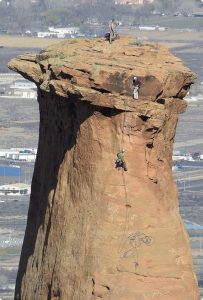 Climbers on the sandstone tower, Independence Monument